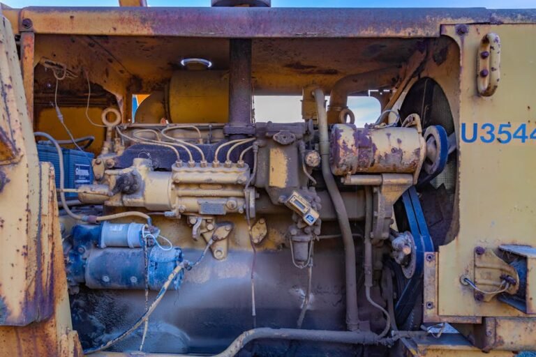Close-up of a rusty diesel engine in an abandoned industrial vehicle.
