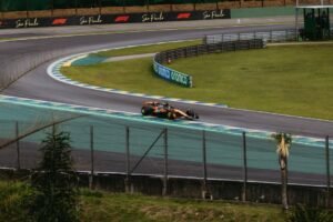 A thrilling Formula 1 race car speeds around a curve at Interlagos in São Paulo, Brazil.
