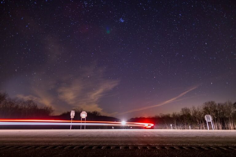 Long exposure of car light trails under a starry night sky in Dunlap, TN.